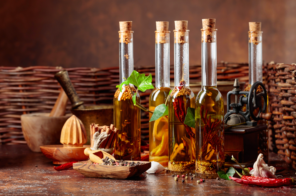 Bottles,Of,Olive,Oil,With,Various,Herbs,And,Spices.,Still
