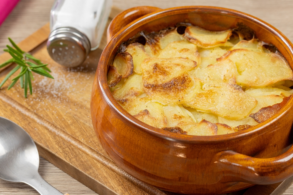 Gratin,Dauphinois,,Close-up,,On,A,Cutting,Board