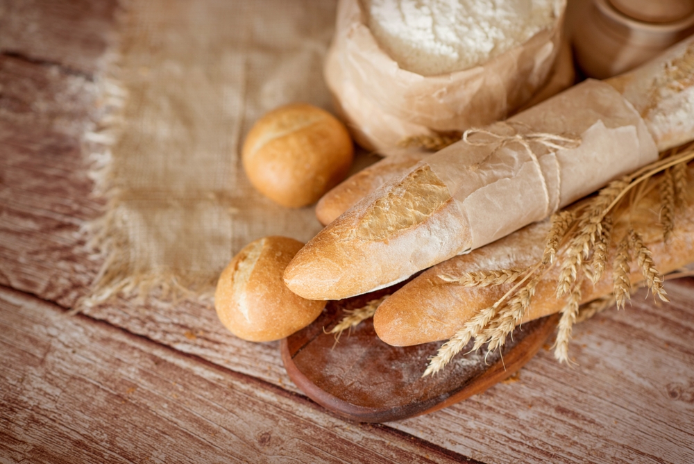 There,Are,Several,Fresh,Baguettes,And,Small,Rolls,On,The
